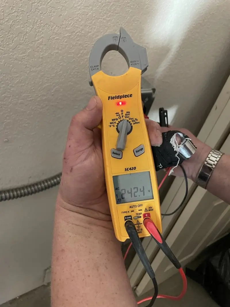 Voltage testing with clamp meter during Whole House Surge Protector in Grants Pass